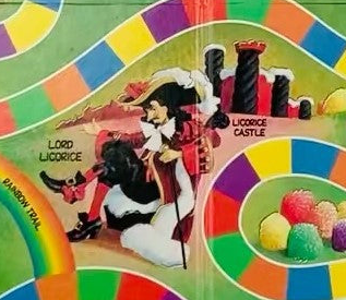 A blurry photo of the 50th Anniversary Edition Lord Licorice. He's much more human, with black hair, a regular pirate hat, and a white fur lining on his cape. He's also seated and not particularly evil looking.